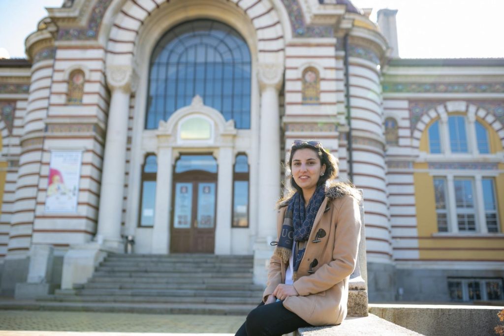 Image of Silsila Mahboub sitting in front of a building