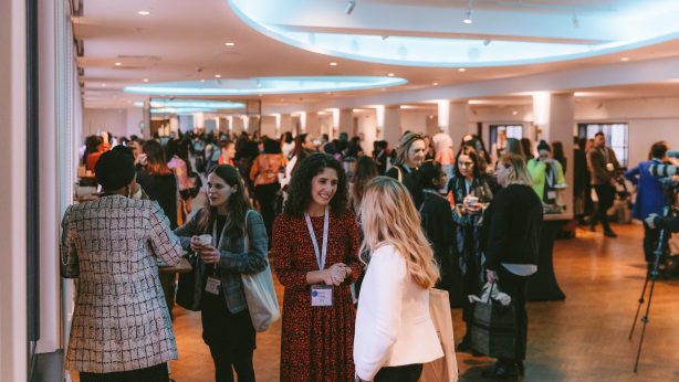 A photograph of women captured networking at Women in Dev conference